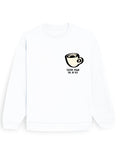 White oversized sweatshirt with small chest-print coffee cup graphic and 'coffee made me do it!!!' text