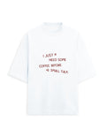 White oversized terry tee with 'I just need some coffee before small talk' handwritten chest print