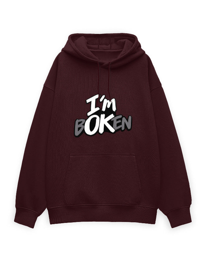 White unisex oversized hoodie with bold graffiti-style text on the chest reading 'I'm Boken' in black and gray with a cracked lettering effect.
