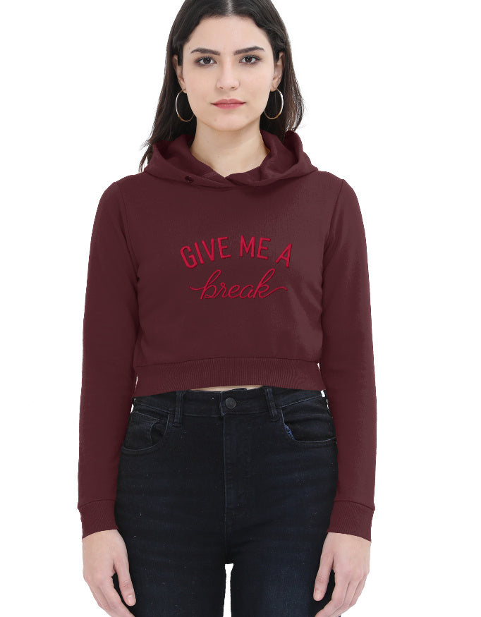 Close-up front view of black cropped hoodie for women with red 'Give Me A Break' script graphic on the front