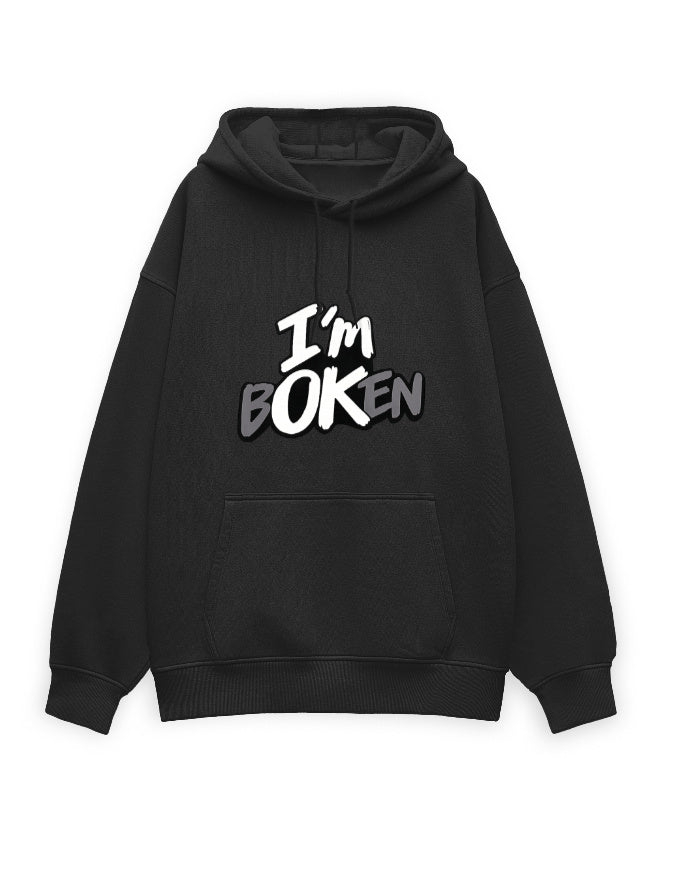 White unisex oversized hoodie with bold graffiti-style text on the chest reading 'I'm Boken' in black and gray with a cracked lettering effect.