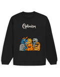 Black oversized sweatshirt with white 'Optimism' script text and a colorful cartoon monster group graphic printed on the front