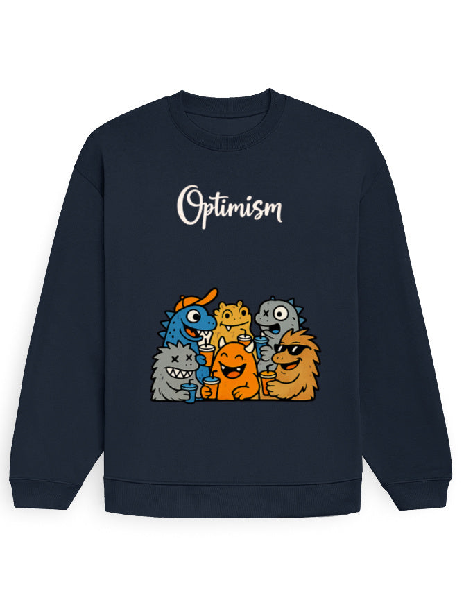Close-up of the 'Optimism' text and cartoon monster group graphic on the Black oversized sweatshirt