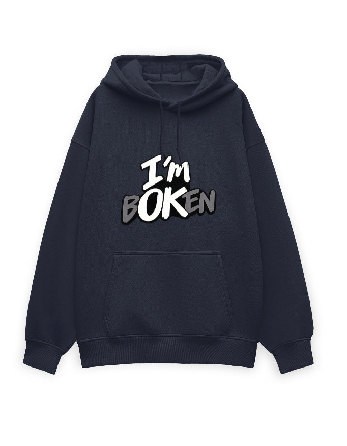 White unisex oversized hoodie with bold graffiti-style text on the chest reading 'I'm Boken' in black and gray with a cracked lettering effect.