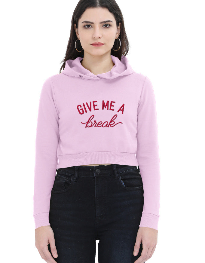 Detail shot of black cropped hoodie for women with red 'Give Me A Break' script graphic on the front