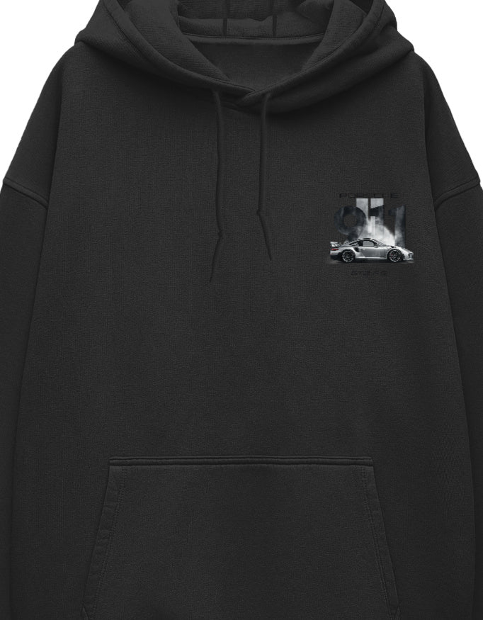 Close-up of monochrome car graphic on white oversized hoodie chest