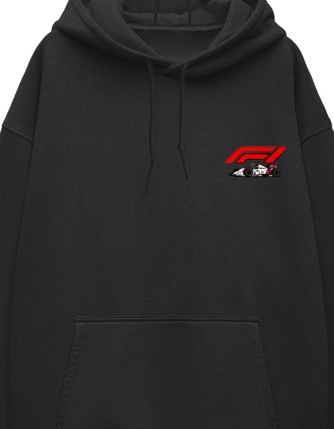 Close-up of racing logo and car graphic on white oversized hoodie chest